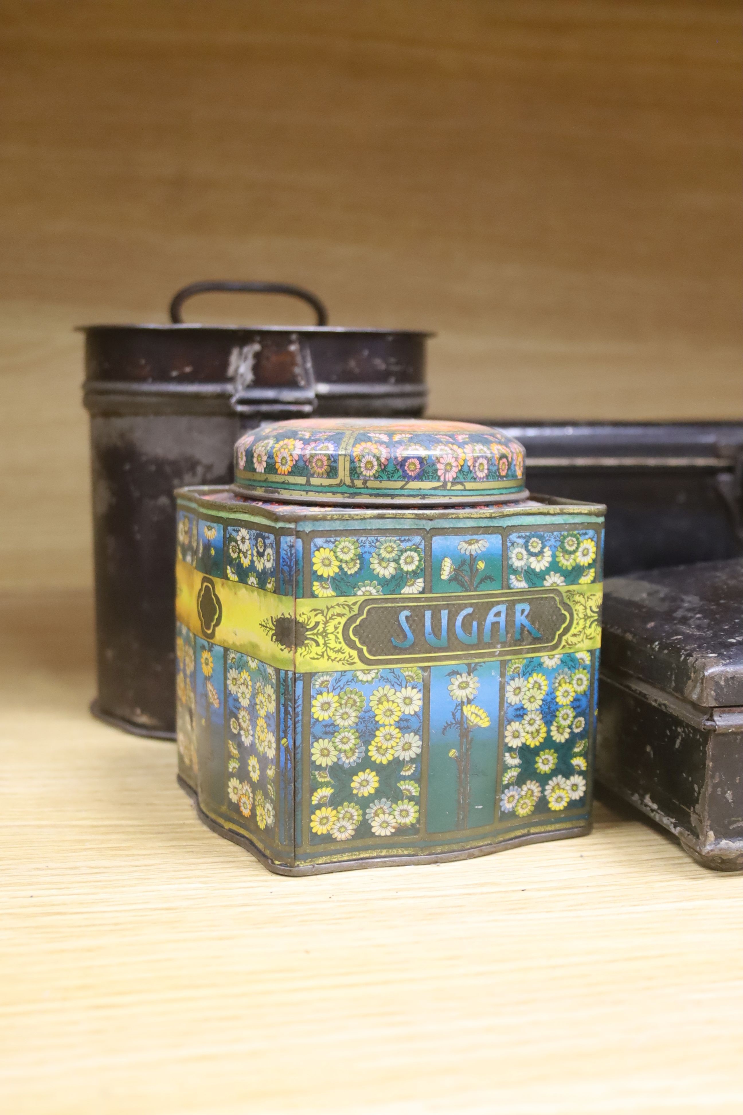 Two 19th century Toleware spice boxes, widest 20cm, and five storage tins